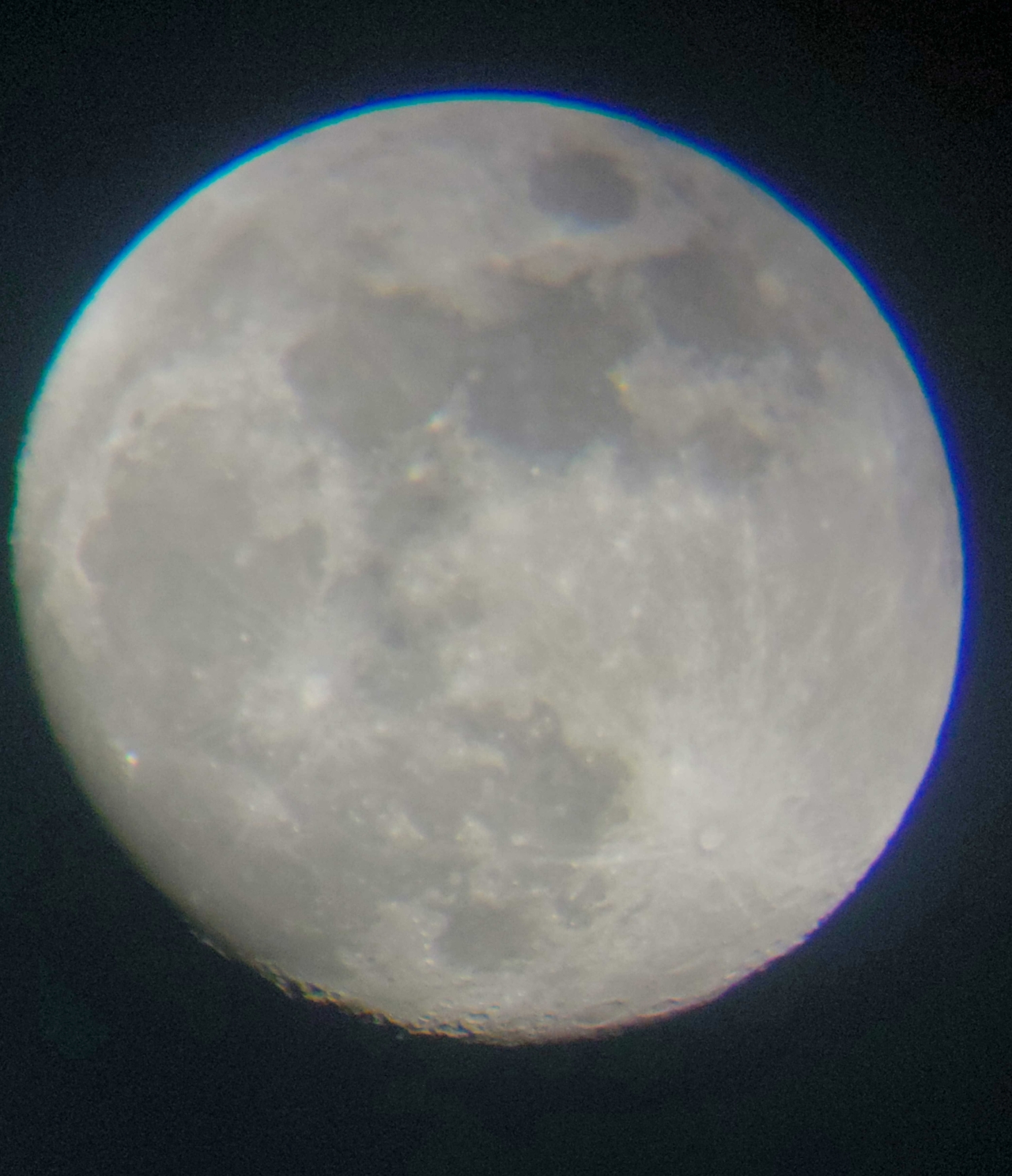 photo of moon as seen through telescope lens
